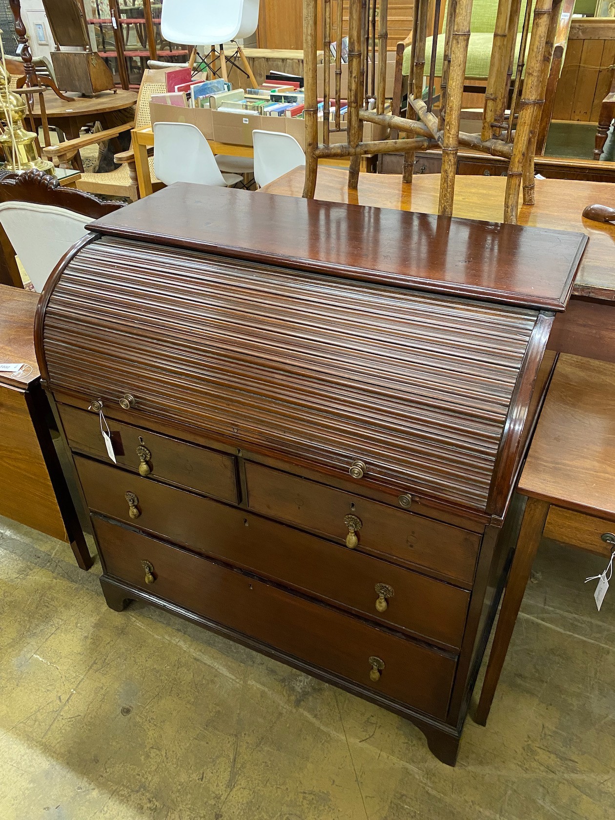 A George IV mahogany tambour cylinder bureau fitted four drawers, width 102cm, depth 57cm, height 105cm.